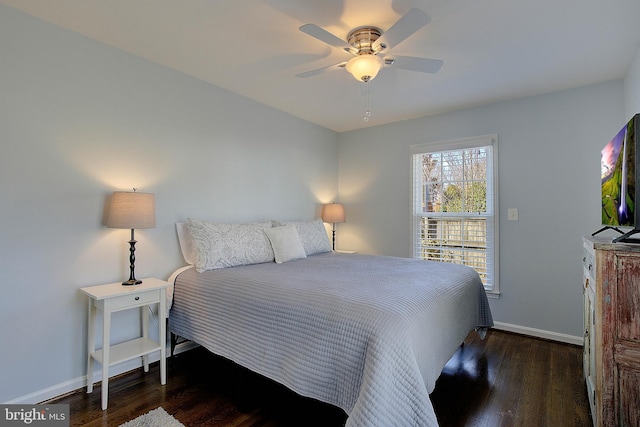 bedroom with baseboards, wood finished floors, and a ceiling fan