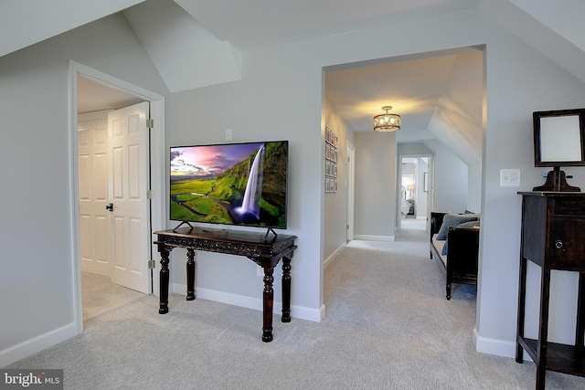 hall with baseboards and carpet flooring