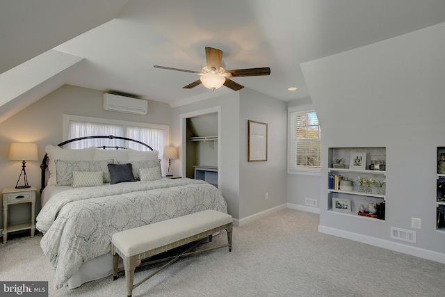 carpeted bedroom with visible vents, ceiling fan, baseboards, an AC wall unit, and lofted ceiling