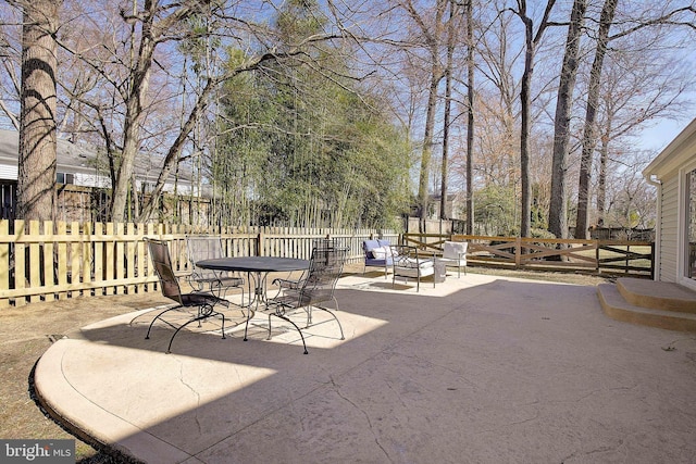 view of patio / terrace featuring outdoor dining area and fence