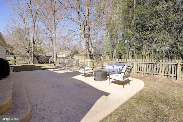 view of patio / terrace featuring a grill, an outdoor hangout area, and a fenced backyard