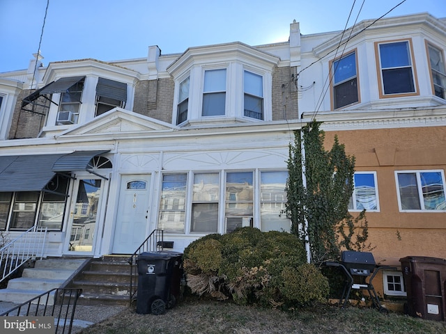 townhome / multi-family property with brick siding