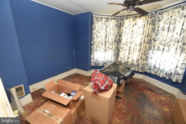 interior space featuring ceiling fan and baseboards