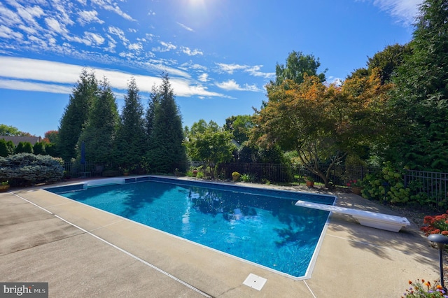 view of swimming pool with a patio area