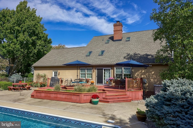 back of property with a patio area and a pool side deck