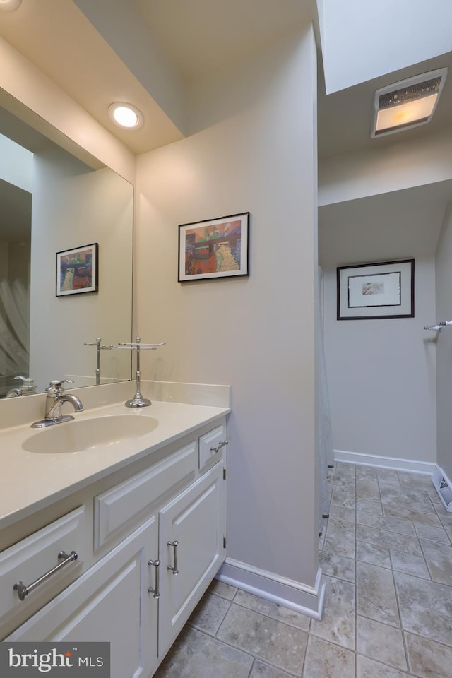 bathroom with vanity and tile patterned floors