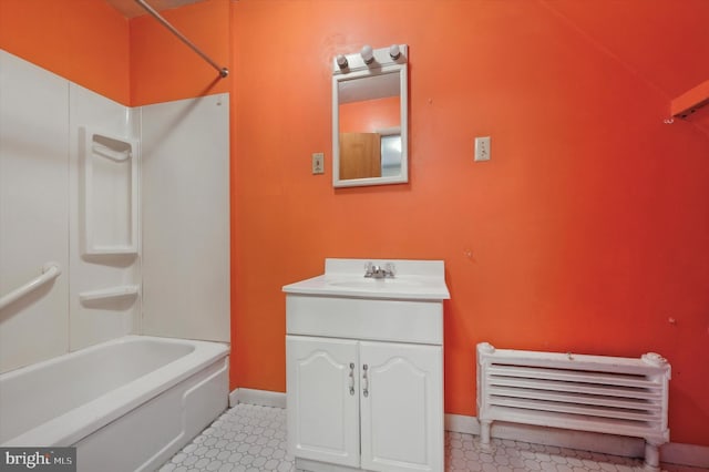 bathroom featuring vanity and  shower combination