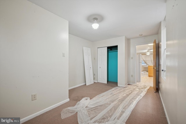 carpeted bedroom with a closet