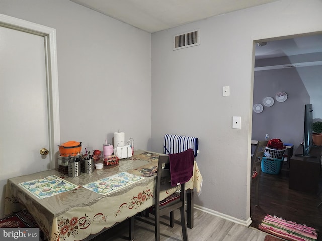 dining area with wood-type flooring