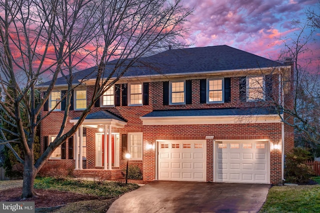 view of front of property featuring a garage