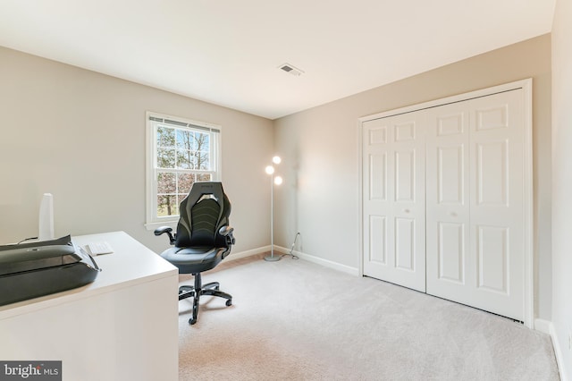 unfurnished office with light colored carpet