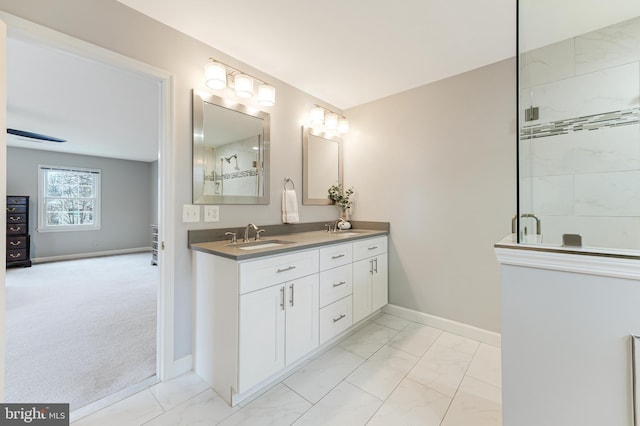 bathroom featuring vanity and an enclosed shower