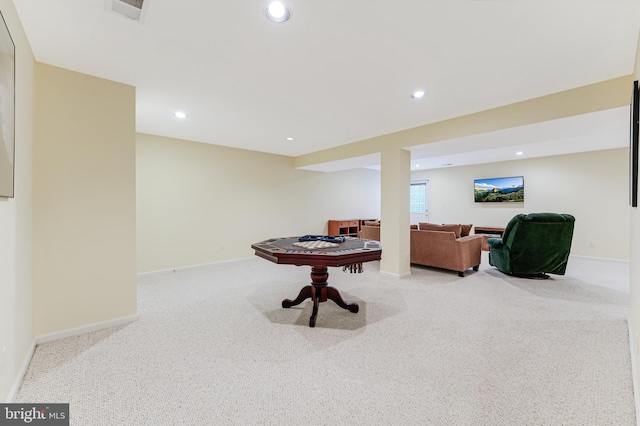 recreation room featuring light colored carpet