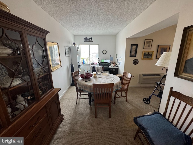 dining room featuring light colored carpet, a wall mounted air conditioner, and a textured ceiling