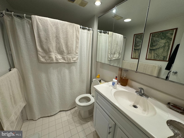 bathroom with vanity, tile patterned flooring, a shower with curtain, and toilet