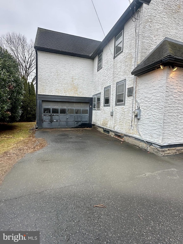 view of home's exterior with a garage