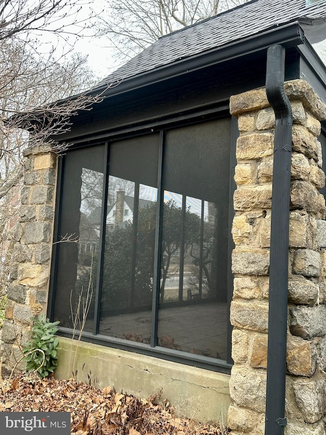 view of side of property with a sunroom