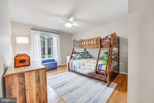 bedroom featuring hardwood / wood-style floors and ceiling fan