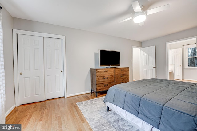 bedroom featuring light hardwood / wood-style floors, a closet, and ceiling fan