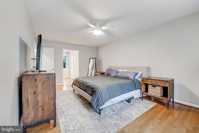 bedroom with ceiling fan and light wood-type flooring