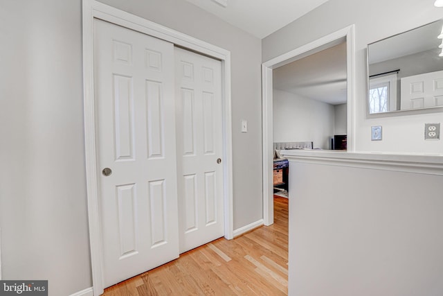 hallway with wood-type flooring