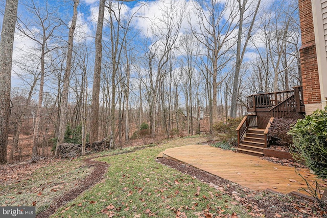 view of yard featuring a wooden deck