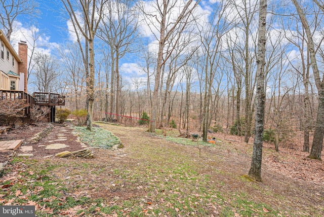 view of yard featuring a wooden deck