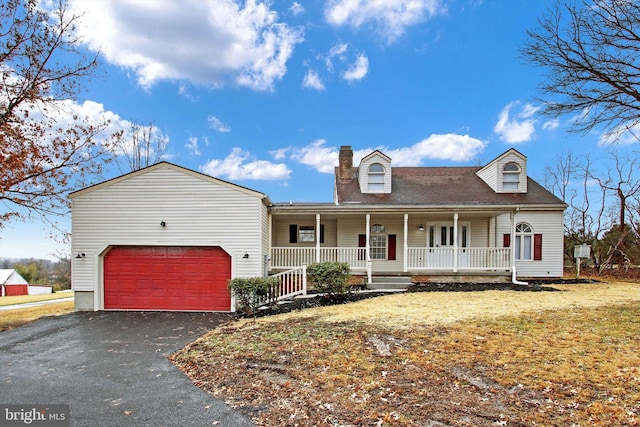 view of front of home featuring a garage and covered porch