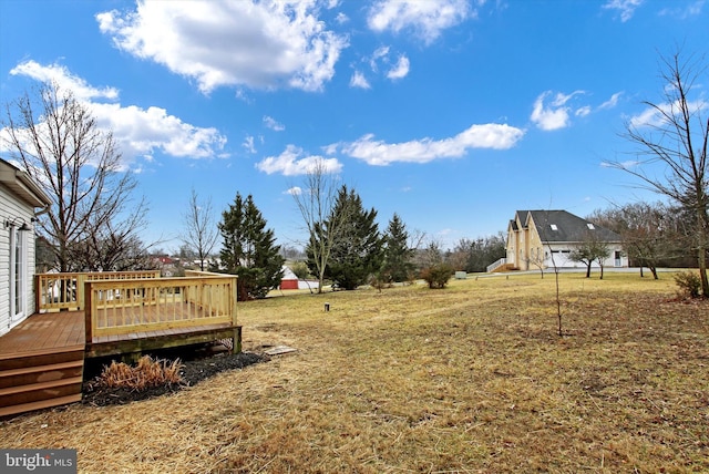 view of yard featuring a deck