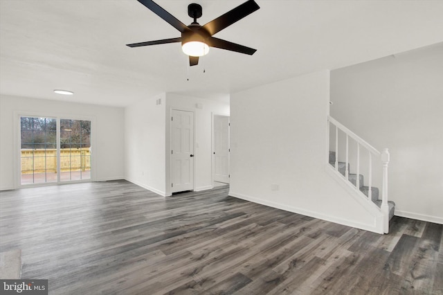 unfurnished living room featuring ceiling fan and dark hardwood / wood-style flooring