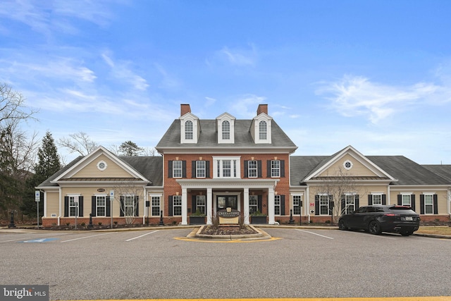 view of property featuring uncovered parking