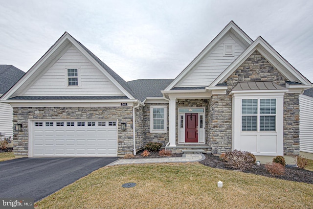 view of front of house featuring a garage and a front lawn