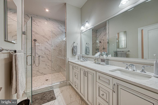 bathroom featuring vanity and an enclosed shower