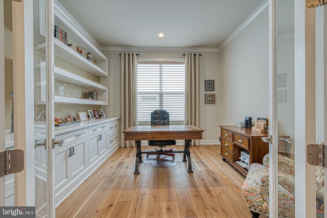 office area with crown molding and light wood-type flooring