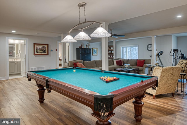 game room with pool table and light hardwood / wood-style flooring