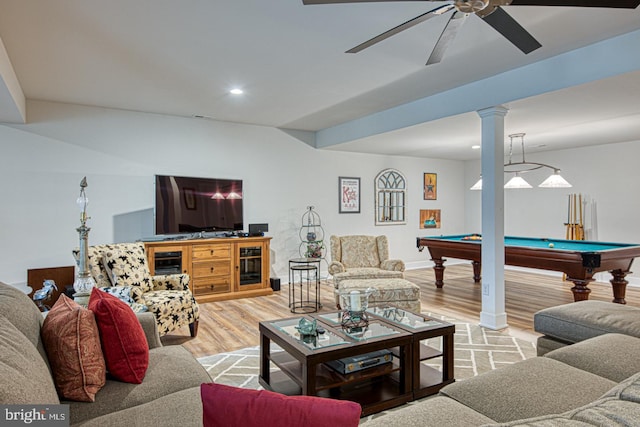 living room with billiards, decorative columns, ceiling fan, and light wood-type flooring