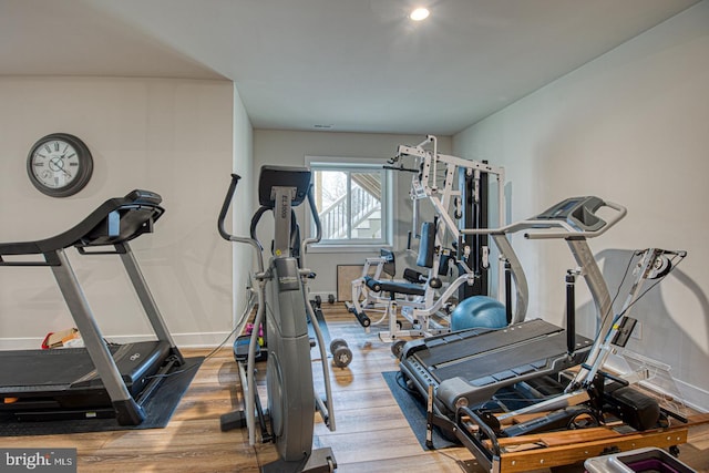 exercise area featuring hardwood / wood-style floors