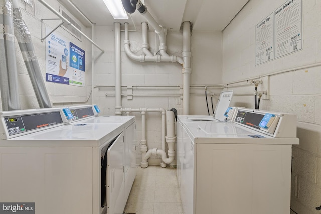 washroom featuring washer and dryer