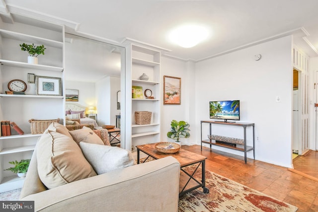 living area featuring light wood-style floors and ornamental molding