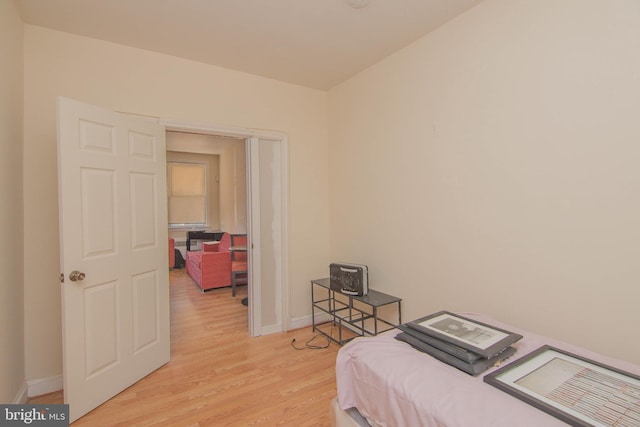 bedroom with light hardwood / wood-style flooring