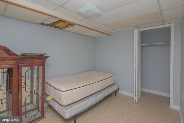 bedroom featuring a drop ceiling