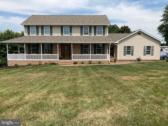 view of front of house featuring a front yard and covered porch