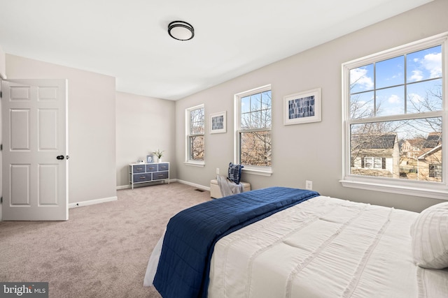 bedroom featuring light colored carpet