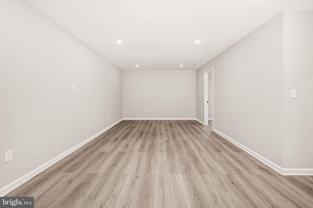 unfurnished room featuring light hardwood / wood-style floors