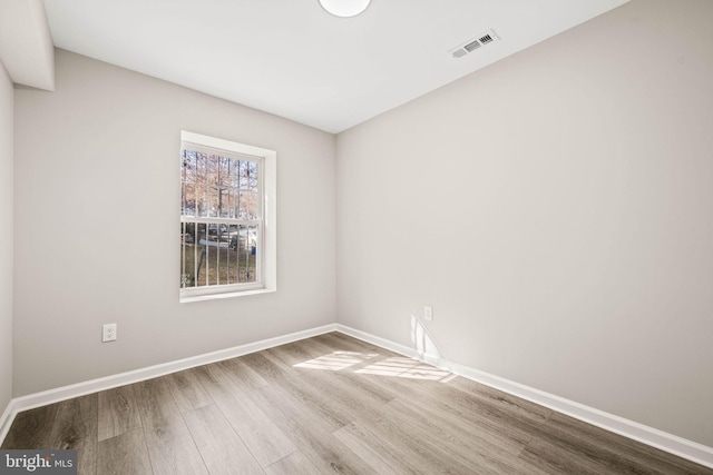 unfurnished room with light hardwood / wood-style flooring