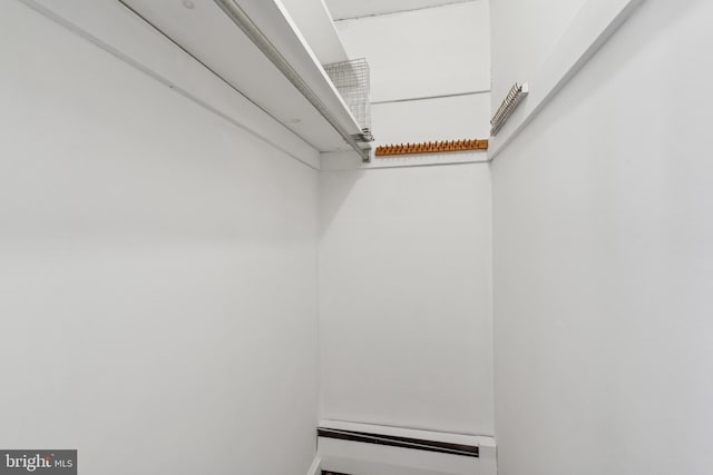 spacious closet with baseboard heating