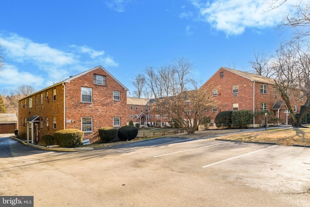 view of property with uncovered parking