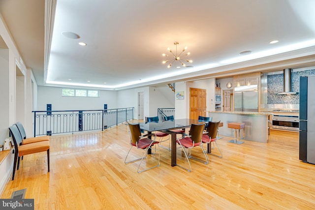 dining area featuring light wood-type flooring, visible vents, a notable chandelier, and recessed lighting