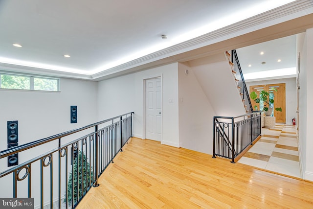 hall featuring wood finished floors and recessed lighting