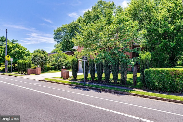 view of road with curbs and sidewalks